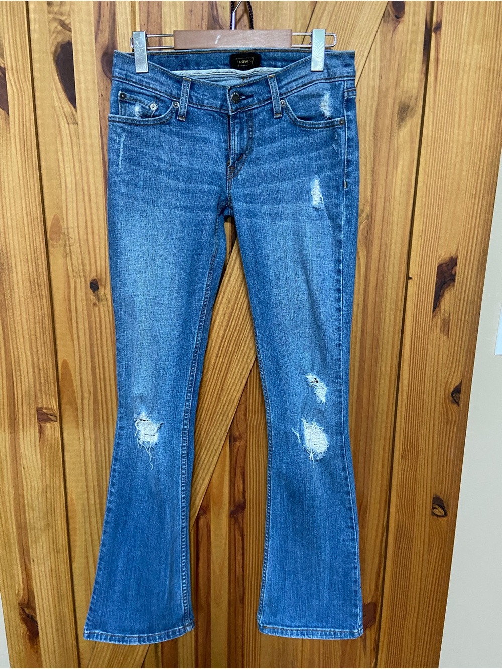 Levi's Women's Distressed Blue Flare Jeans with wear Black wing 🪽 label